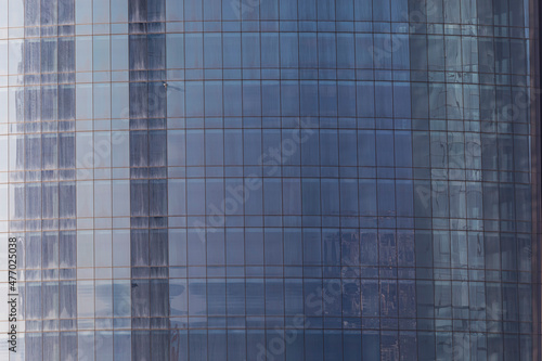Glass facades of skyscraper...