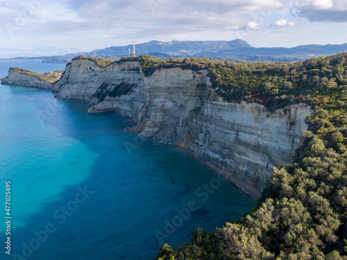 Aerial drone photo of iconic white rock steep cliff volcanic bay of Cape Drastis and Peroulades area with tropical deep turquoise clear sea, Corfu island, Ionian, Greece