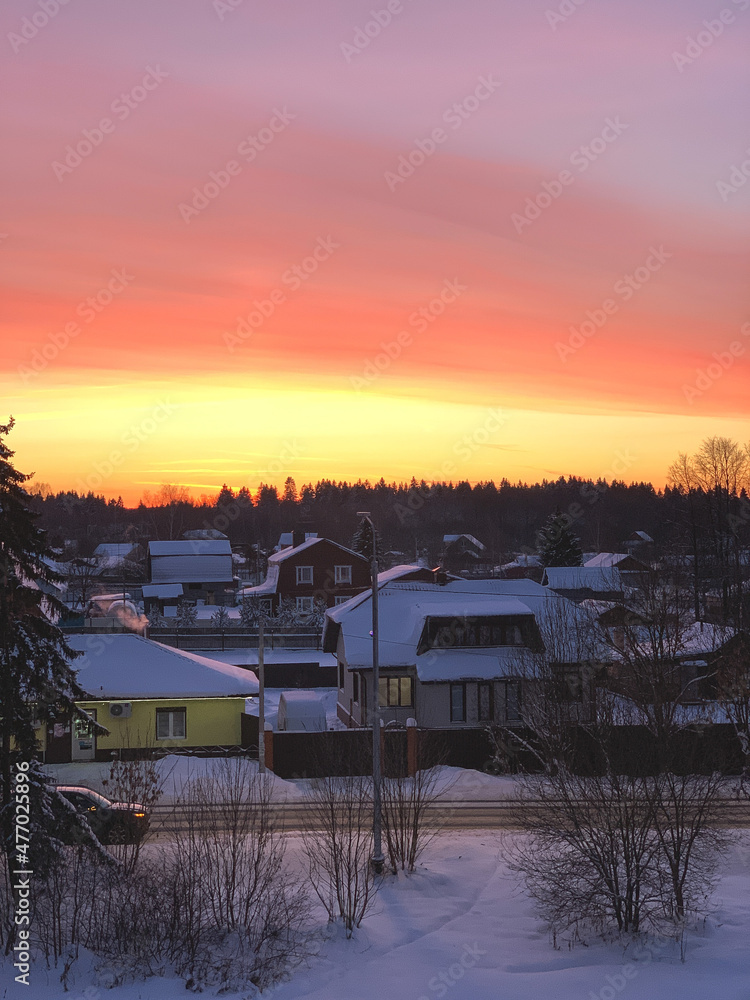 sunset, village, winter, red sunset, fiery sunset, trees without leaves, snow on the roofs, car on a snowy road