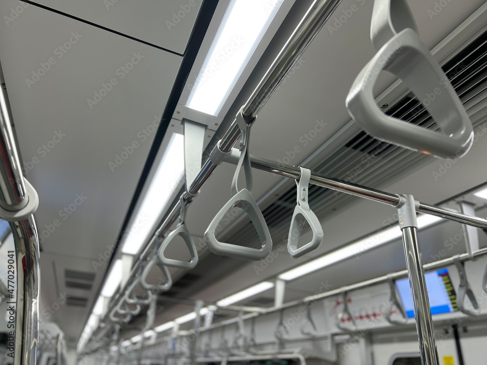 Hanging straps in Subway , empty background of metro train Hanging straps in Subway , empty background of metro train