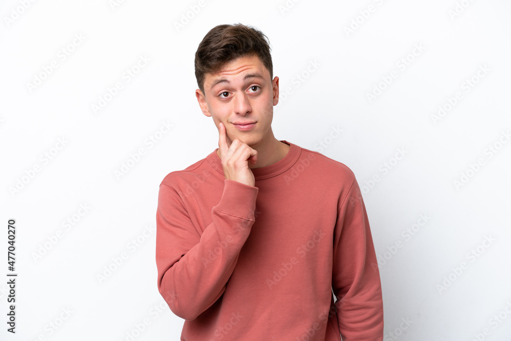 Young handsome Brazilian man isolated on white background and thinking Young handsome Brazilian man isolated on white background and thinking