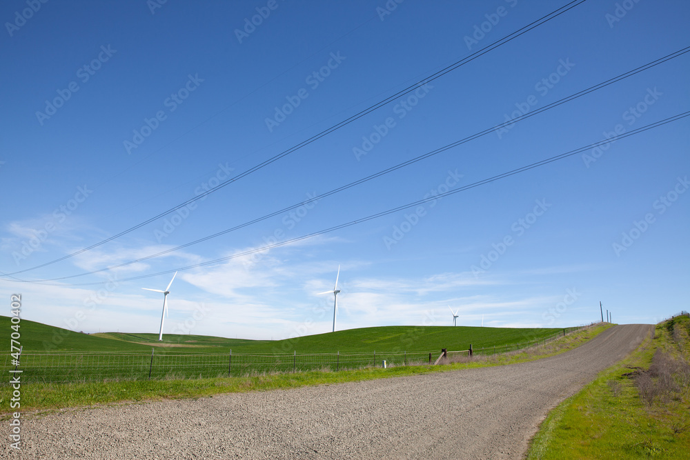 Wind turbines with blue sky and country road Wind turbines with blue sky and country road