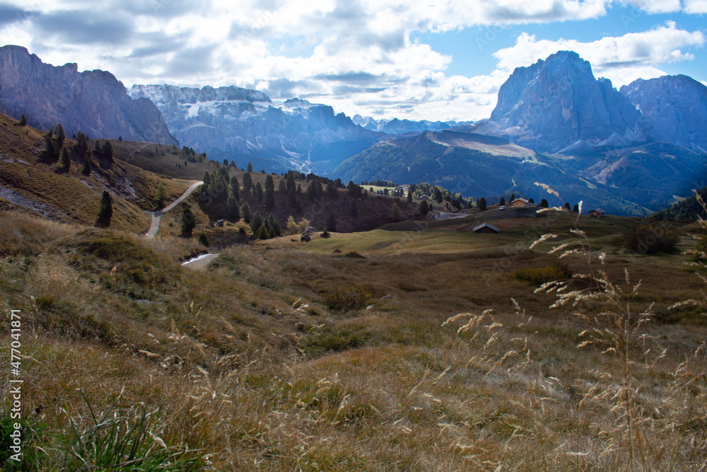 Hiking Dolomites in European Alps. Shot in summer with green grass and no snow. Gardena Pass, Italy