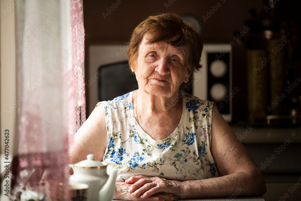 Portrait of an elderly village woman in her home.