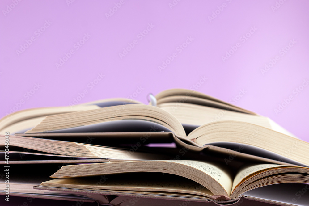 Opened books on pink background. Study, education and back to school concept. Opened books on pink background. Study, education and back to school concept.