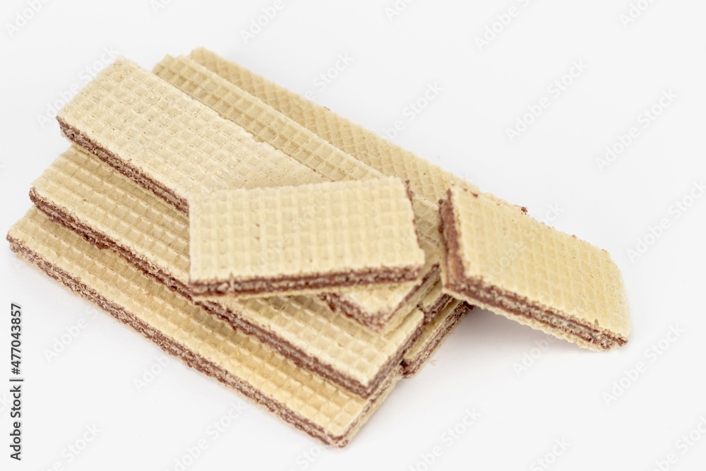 Neapolitan wafers. Wafers with chocolate on a white backgrounds. Neapolitan wafers. Wafers with chocolate on a white backgrounds.