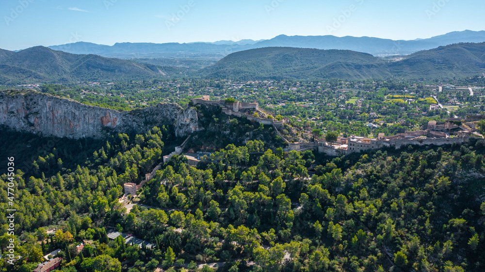 Aerial photo from drone to ancient famous castle of Xativa against the backdrop of mountain valleys  a sunny summer day. Xativa,Valencia, Spain,Europe (Series)