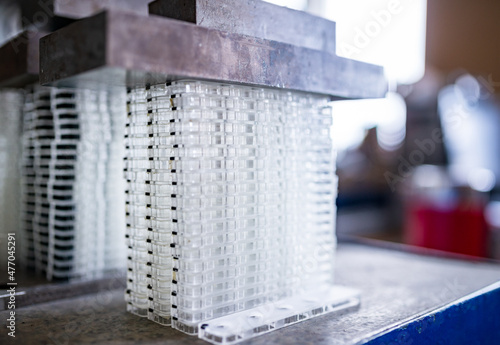 Stacks of glass containers under press for TFT displays