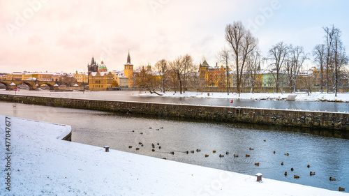 Snow on embankment in winter Prague photo