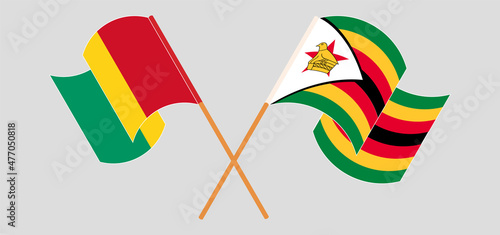 Crossed flags of Guinea and Zimbabwe. Official colors. Correct proportion