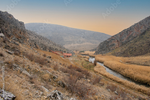 Farm in a valley with river © Ayhan