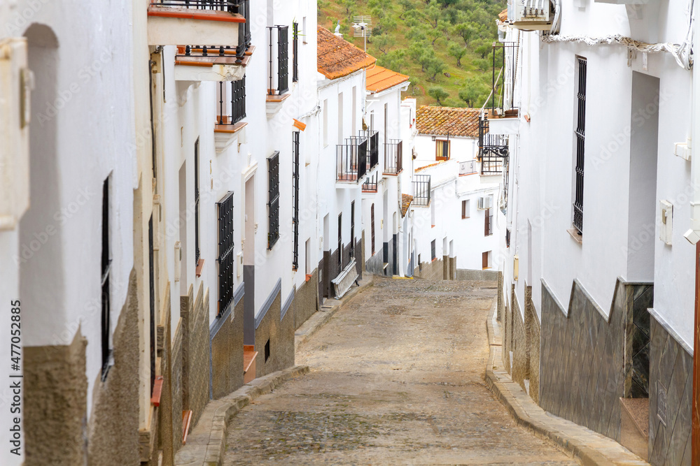 Cobbled street and houses in the town of Aroche, Huelva, Spain 