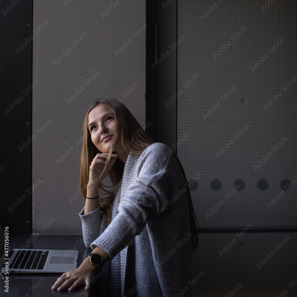 Pretty, young woman with her laptop studying for an exam/working Pretty, young woman with her laptop studying for an exam/working