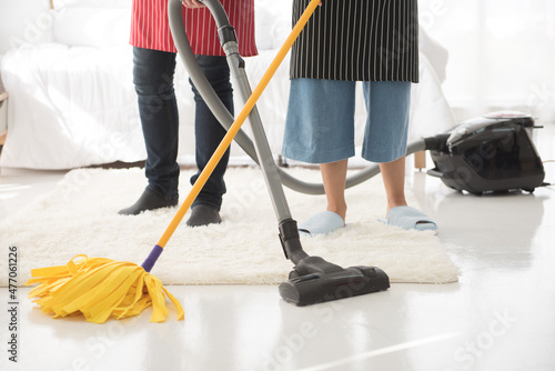 Couples are happy to clean up their homes and bedrooms by cleaning and mopping the floor.