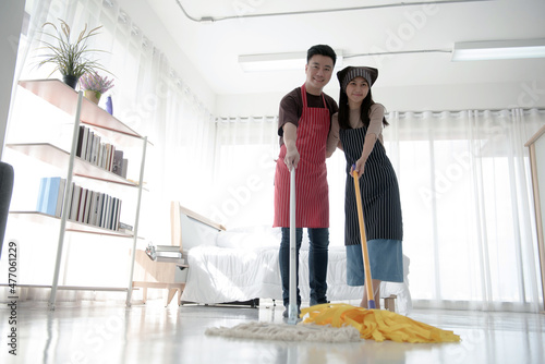 Couples are happy to clean up their homes and bedrooms by cleaning and mopping the floor.