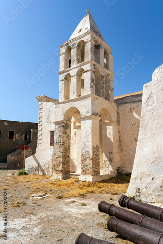 Panagia Myrtidiotissa old Medieval Greek Orthodox Church at Chora Kythira island, Kithira, Greece. Belfry two bells stonewall building. photo