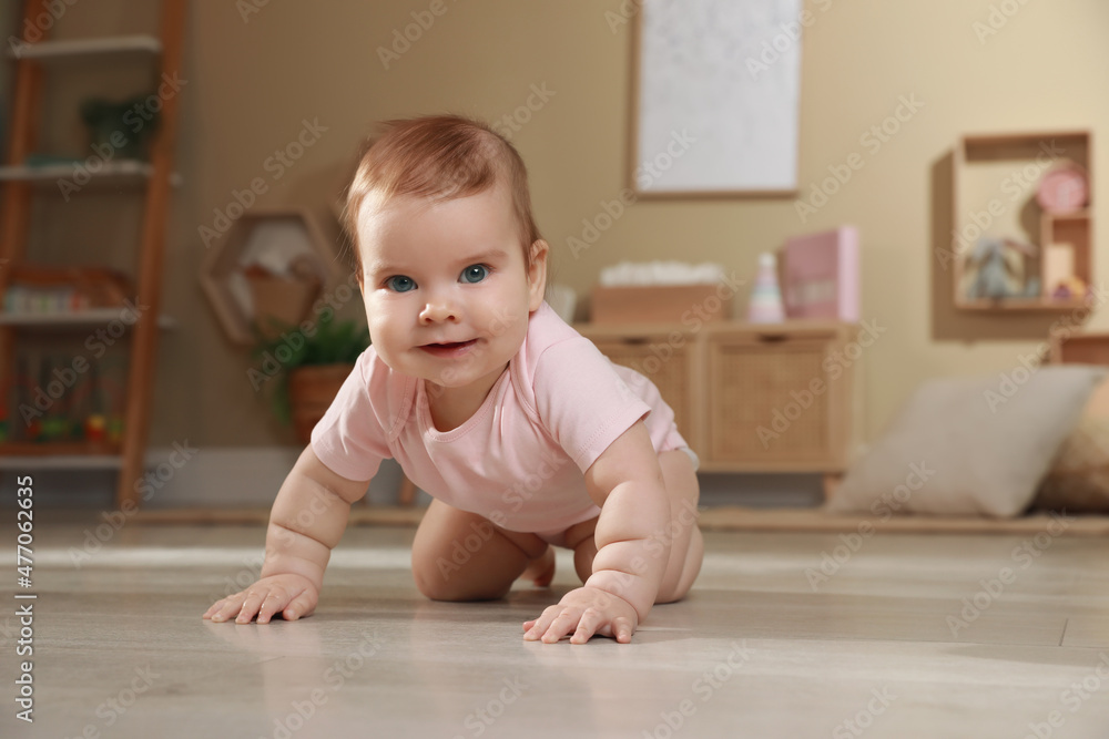 Cute baby crawling on floor at home Cute baby crawling on floor at home