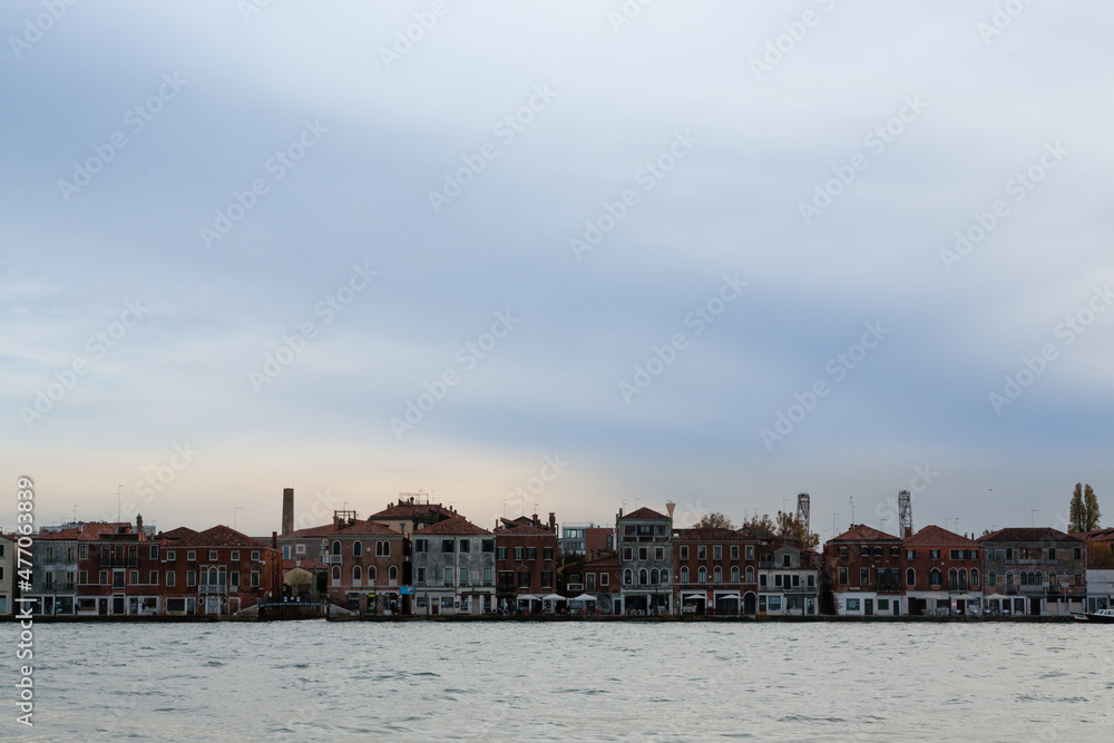 Naklejka premium Venetian houses in row. Venice minimal landscape, Italy