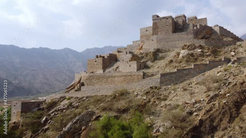 Aerial view in front of the Zee Aayn Village, in sunny Saudi Arabia - rising, drone shot