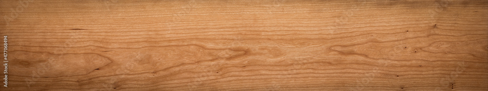 Natural texture background of intact long wooden planks. Cherry wood plank texture background. Natural texture background of intact long wooden planks. Cherry wood plank texture background.
