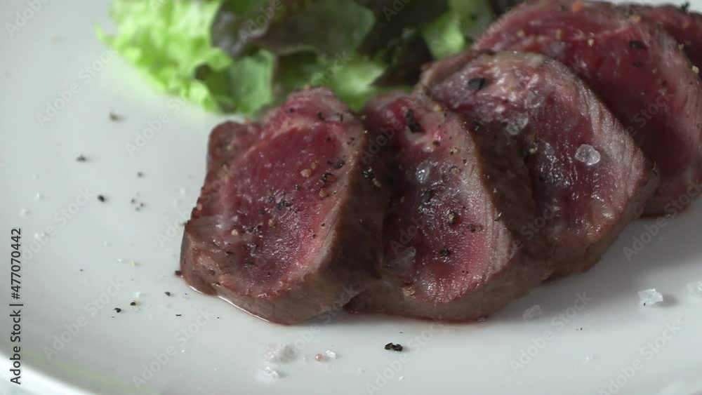 Steak and lettuce baked in rare on a rotating plate.
Steak and lettuce baked in rare on a rotating plate.