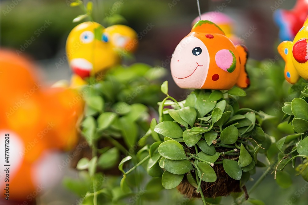 Cute cartoon ceramic hanging with air plant for Indoor outdoor decorative handmade.Beautiful Ornamental gardening clay doll. Cute cartoon ceramic hanging with air plant for Indoor outdoor decorative handmade.Beautiful Ornamental gardening clay doll.