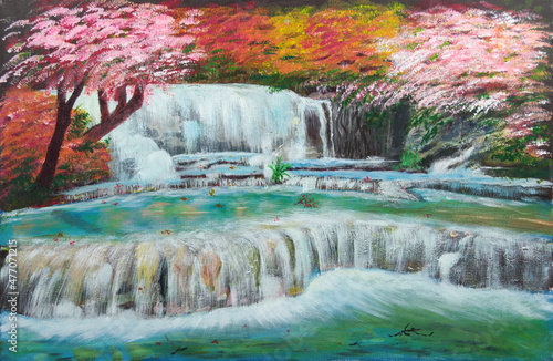 Fototapeta Naklejka Na Ścianę i Meble -  Gentle waterfalls surrounded by beautiful flowering trees of autumn