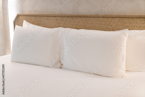 comfortable white pillows on bed
