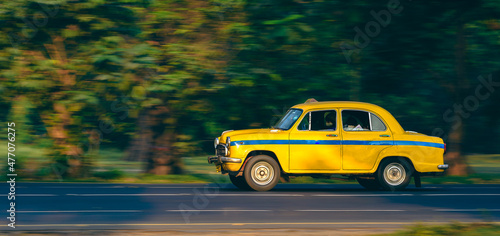 Photography Ambassador Car made Yellow Taxi for Public transport