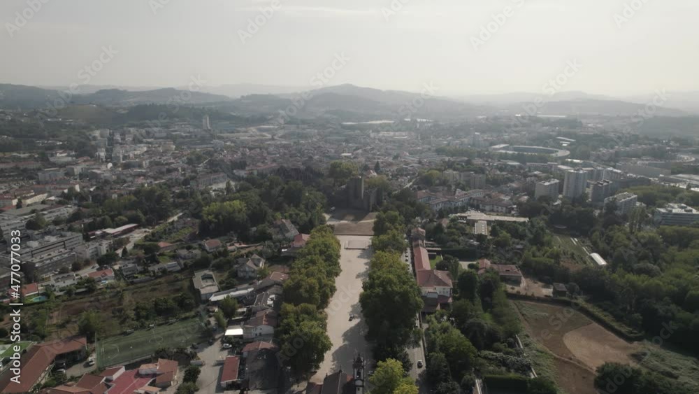 Aerial view of Castle of Guimaraes historic european landmark, pull in shot Aerial view of Castle of Guimaraes historic european landmark, pull in shot