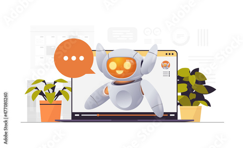 cute robot cyborg with chat bubble on laptop screen modern robotic character artificial intelligence technology