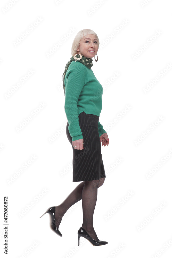 in full growth. woman in a green jumper striding forward. in full growth. woman in a green jumper striding forward.
