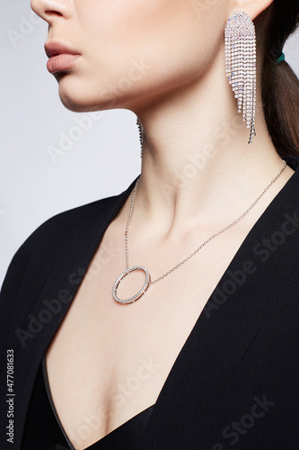 Beautiful young woman with jewelry necklace