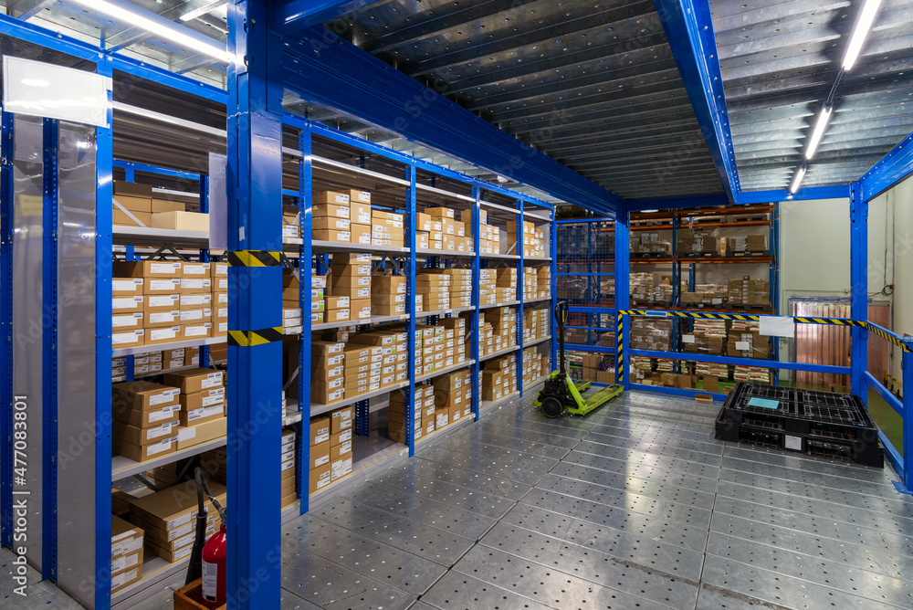 Interior of logistics warehouse with racks and shelves