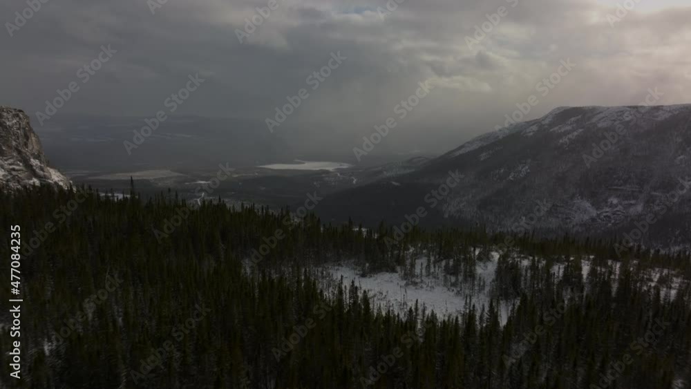Dusky Sky Over The Mountains Hikes In Mont du Lac a L'Empeche During Winter In Quebec, Canada. Aerial Pullback Dusky Sky Over The Mountains Hikes In Mont du Lac a L'Empeche During Winter In Quebec, Canada. Aerial Pullback