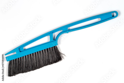 Snow cleaning brush on a white background.