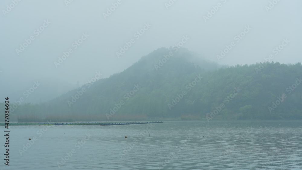 The beautiful lake landscapes with the traditional Chinese architecture along the shore