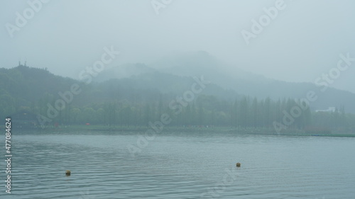 The beautiful lake landscapes with the traditional Chinese architecture along the shore