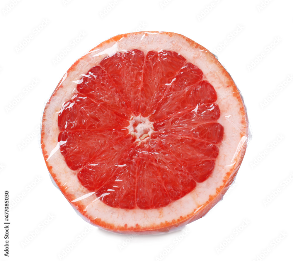 Half of fresh grapefruit wrapped with transparent plastic stretch film isolated on white Half of fresh grapefruit wrapped with transparent plastic stretch film isolated on white
