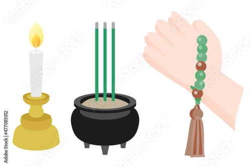 仏教の線香と蝋燭と合掌をする手