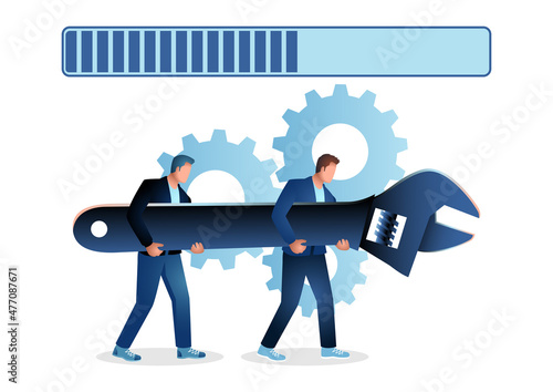 Men holding giant wrench