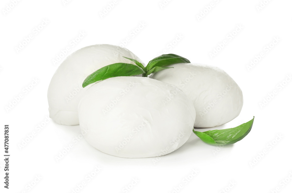 Delicious mozzarella cheese balls and basil on white background Delicious mozzarella cheese balls and basil on white background