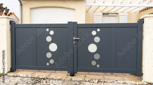 portal modern design street suburb home grey house gate garden access door photo