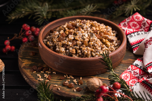 Kutya. Traditional Christmas slavic dish kutia porridge made of wheat grains, poppy seed, nuts, raisins and honey. Eastern Orthodox Christians in Ukraine, Belarus and Russia. photo