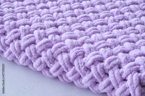 Warm lilac-colored blanket, home comfort and warmth.