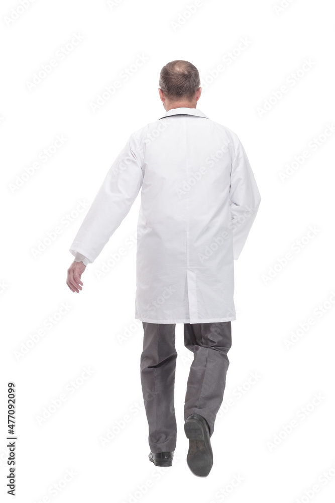 Mature male doctor striding forward. isolated on a white background. Mature male doctor striding forward. isolated on a white background.