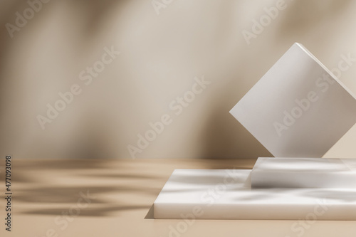 Abstract minimal nature scene - empty stage and white podium on beige background and soft shadows of tree leaves. Pedestal for cosmetic product and packaging mockups display presentation
