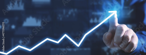 Male hand touching in financial growth arrow.