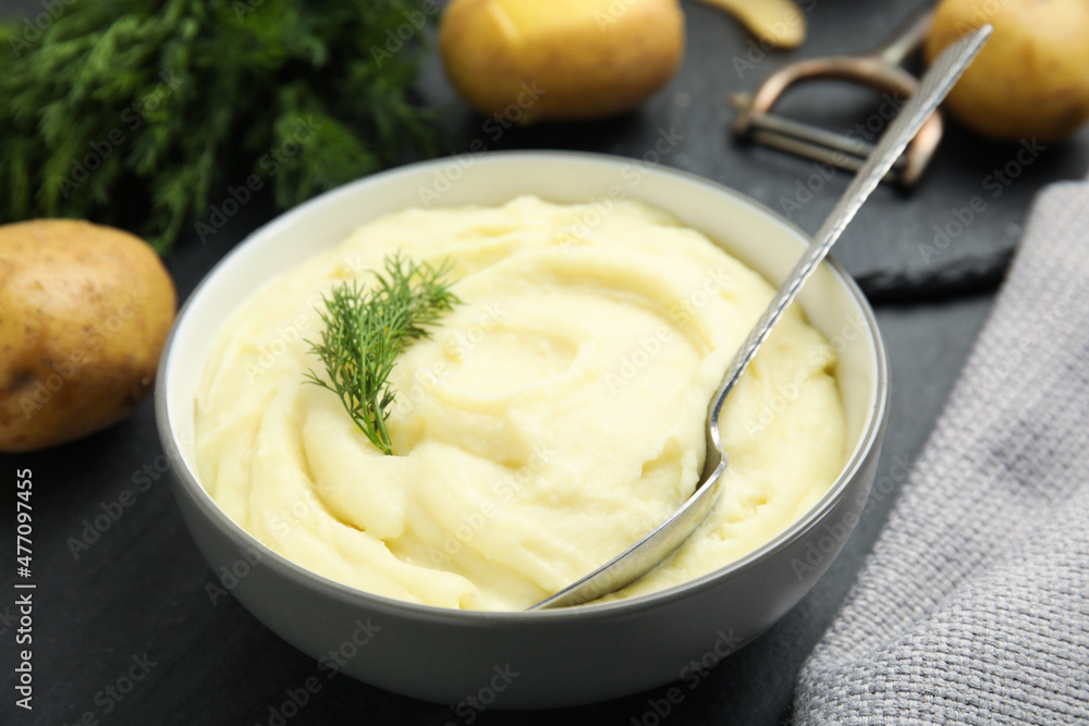 Freshly cooked homemade mashed potatoes on dark grey table, closeup Freshly cooked homemade mashed potatoes on dark grey table, closeup