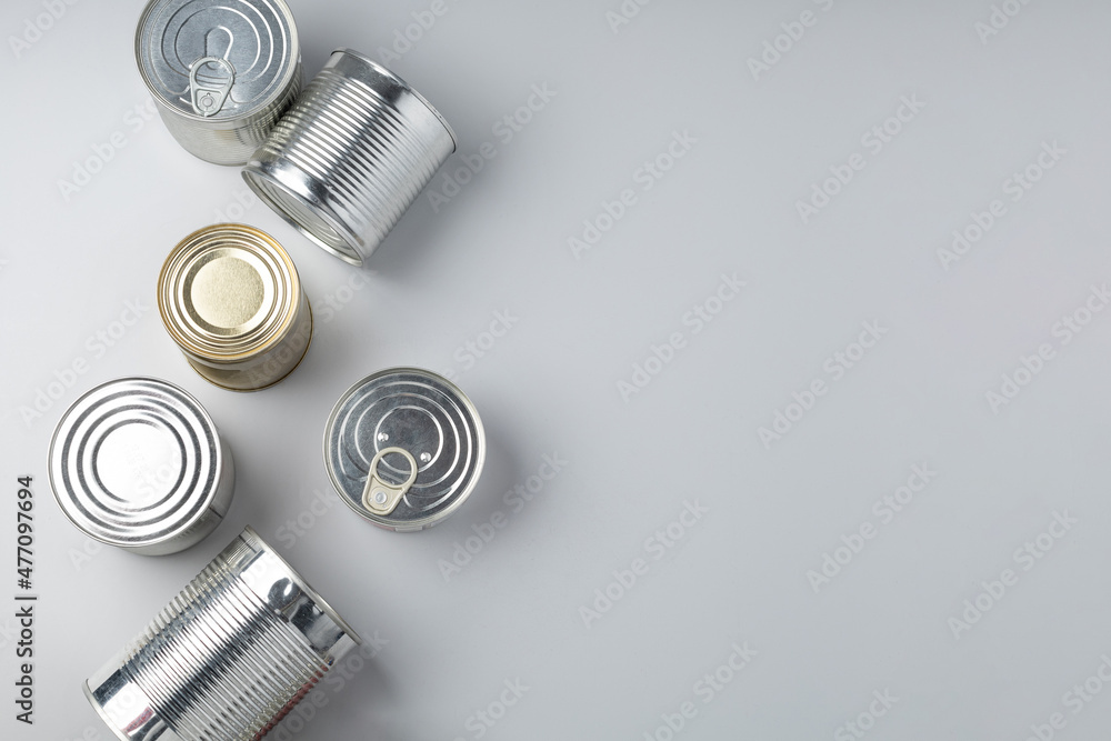 Closed whole aluminum cans on gray background Closed whole aluminum cans on gray background
